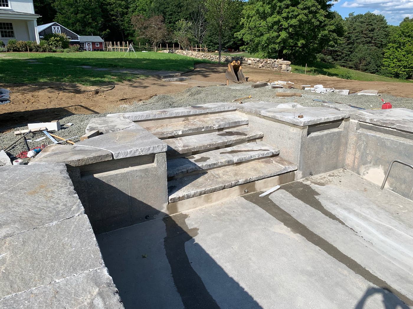 Granite pool coping and steps under construction